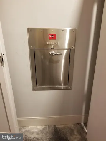 an entryway with wooden floor and windows