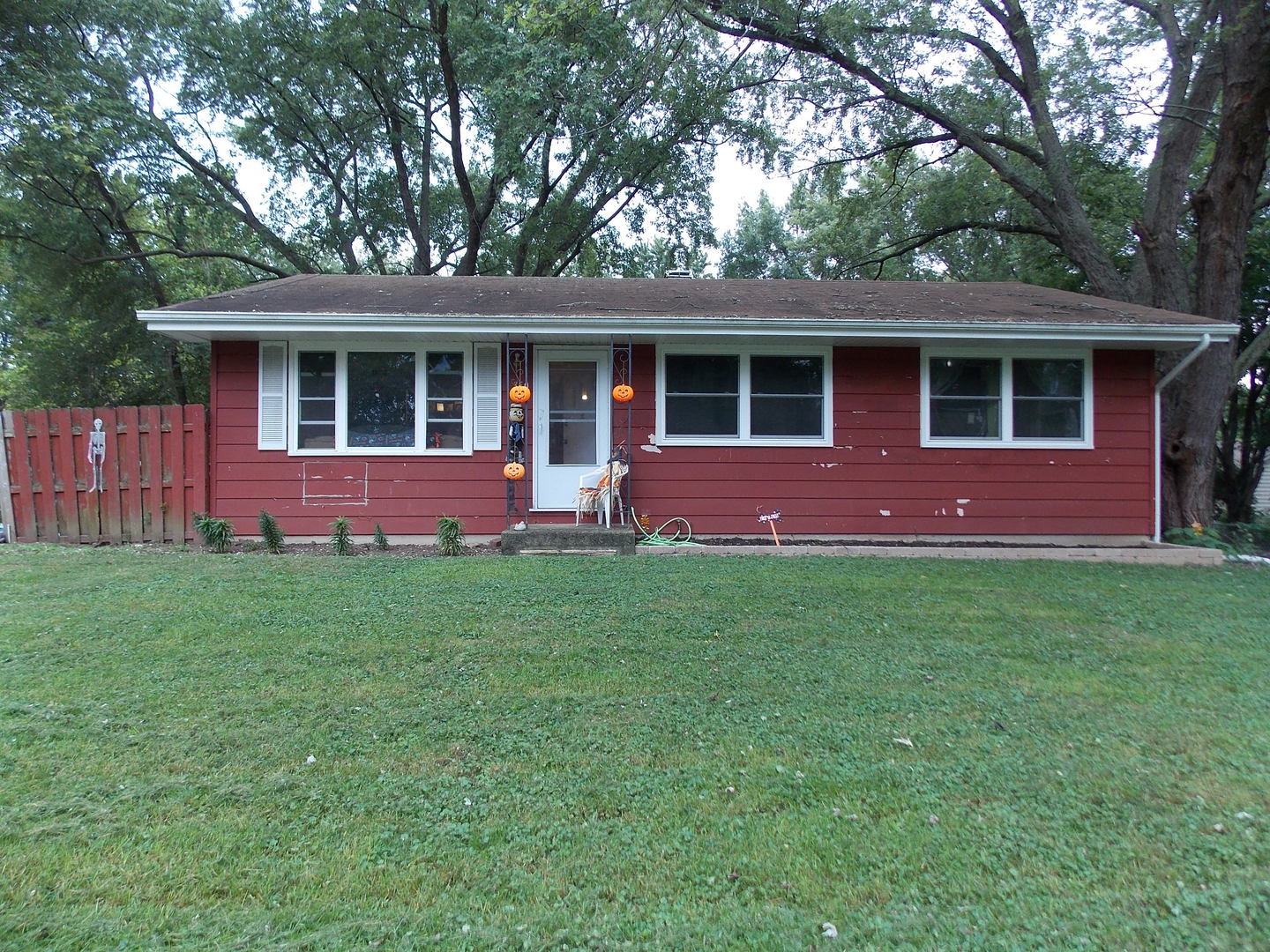 a front view of a house with a yard and front yard