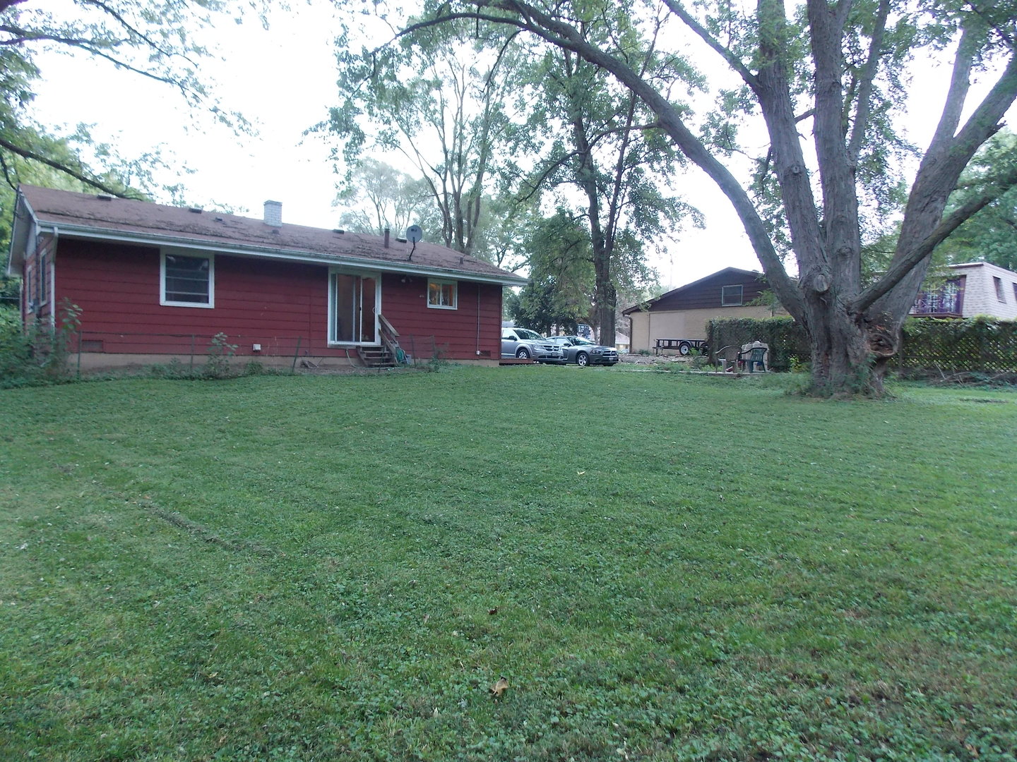 350 Orion Road Batavia, IL 60510 - Photo 13 of 13 a view of a yard in front of a house with large trees