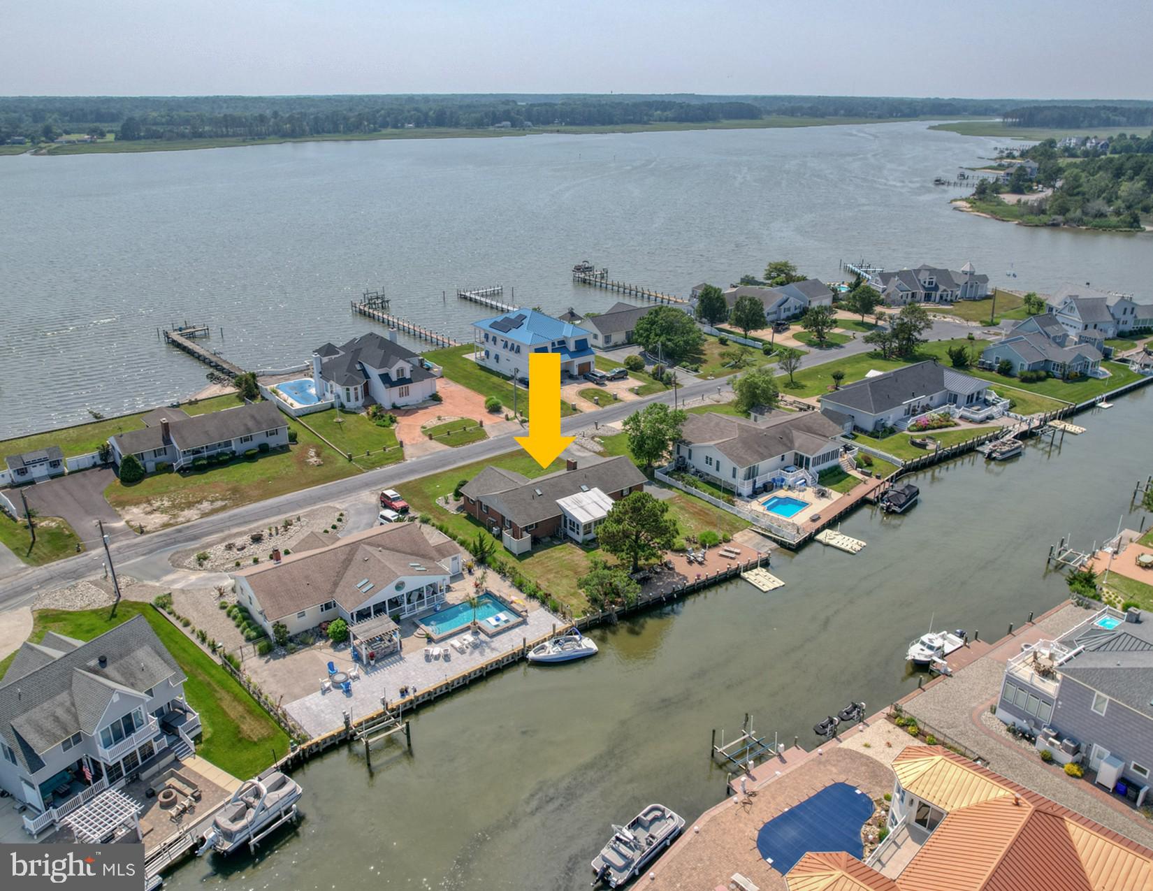 an aerial view of a house with a lake view
