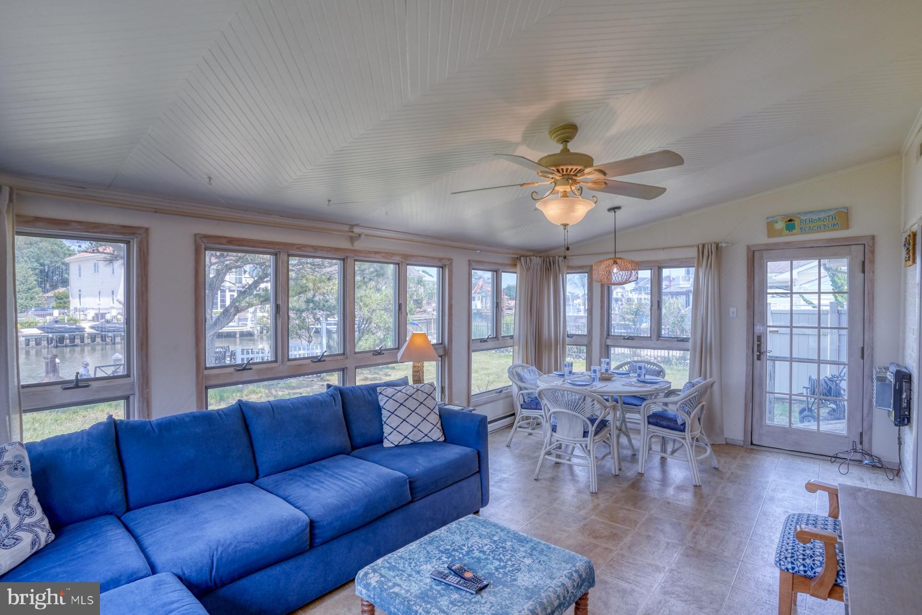 28 Marshall Road Rehoboth Beach, DE 19971 - Photo 19 of 60 a living room with furniture large window and wooden floor