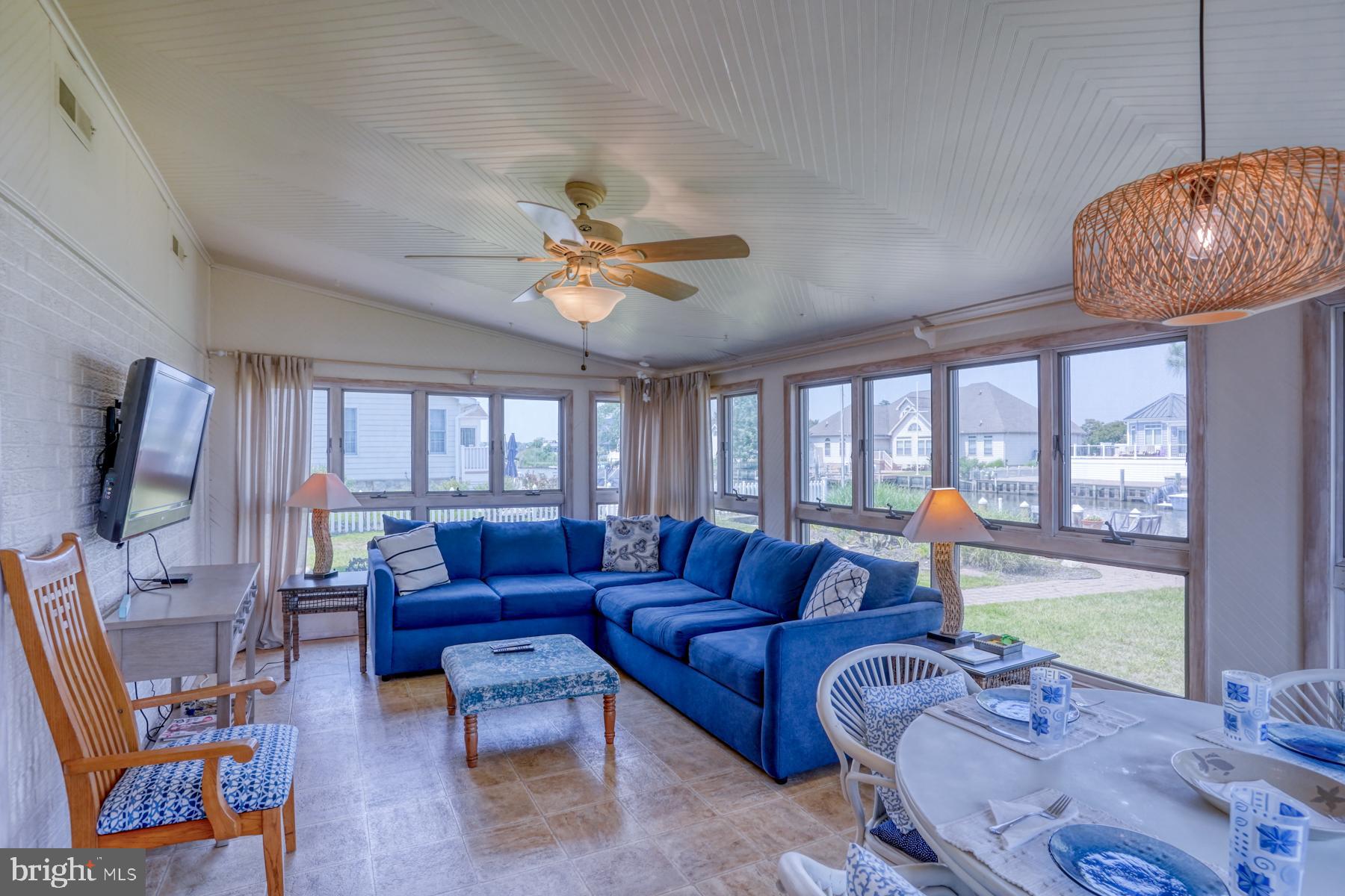 28 Marshall Road Rehoboth Beach, DE 19971 - Photo 20 of 60 a living room with furniture ceiling fan and a large window