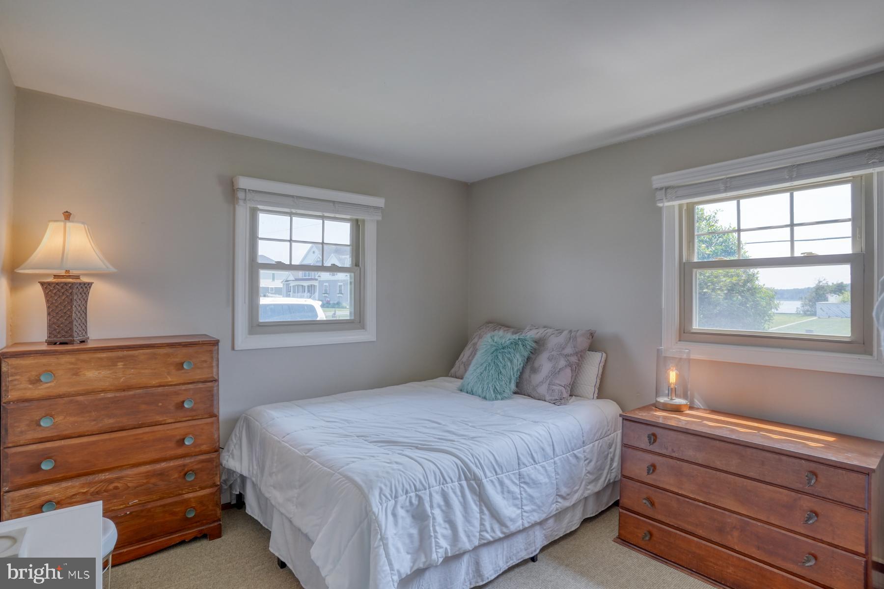 28 Marshall Road Rehoboth Beach, DE 19971 - Photo 25 of 60 a bedroom with a bed and a window