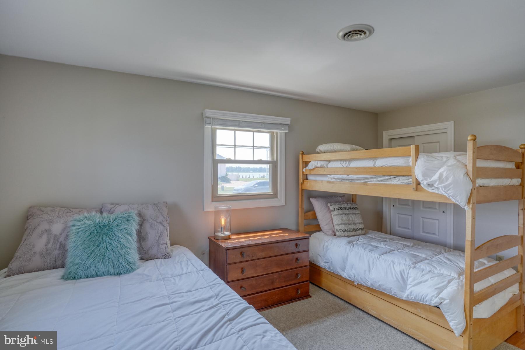 28 Marshall Road Rehoboth Beach, DE 19971 - Photo 26 of 60 a bedroom with a bed and a window