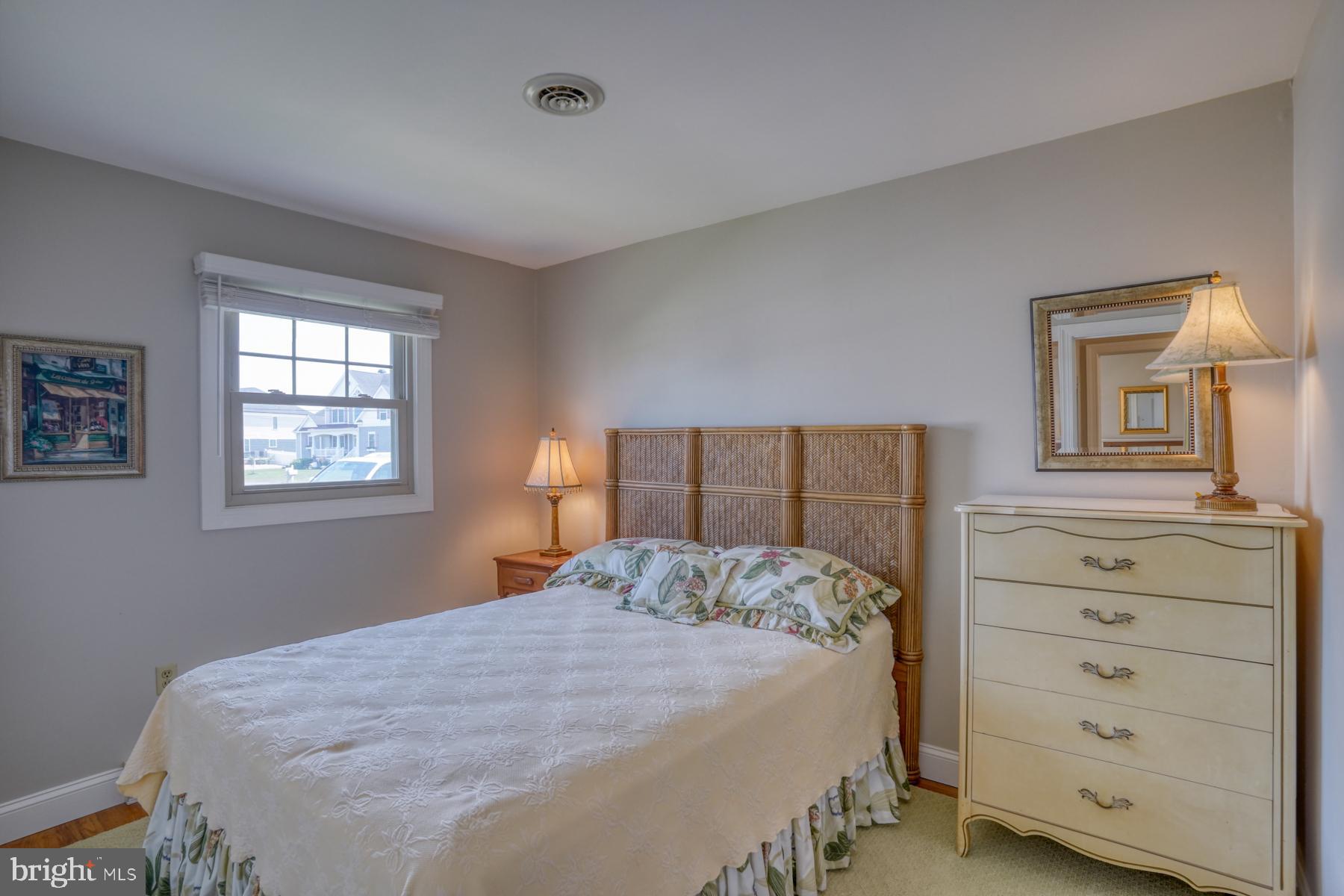 28 Marshall Road Rehoboth Beach, DE 19971 - Photo 27 of 60 a bedroom with a bed and a window