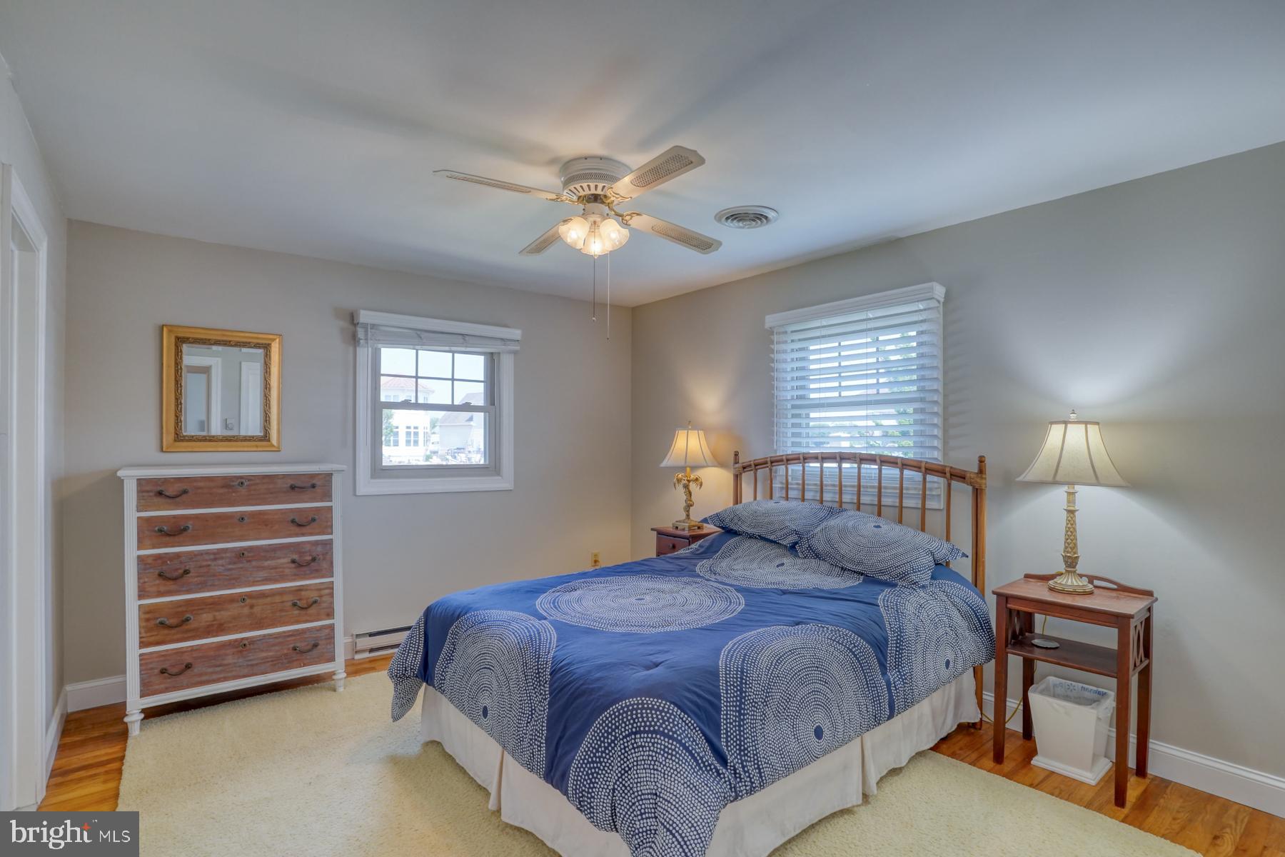 28 Marshall Road Rehoboth Beach, DE 19971 - Photo 29 of 60 a bedroom with a bed and a chandelier