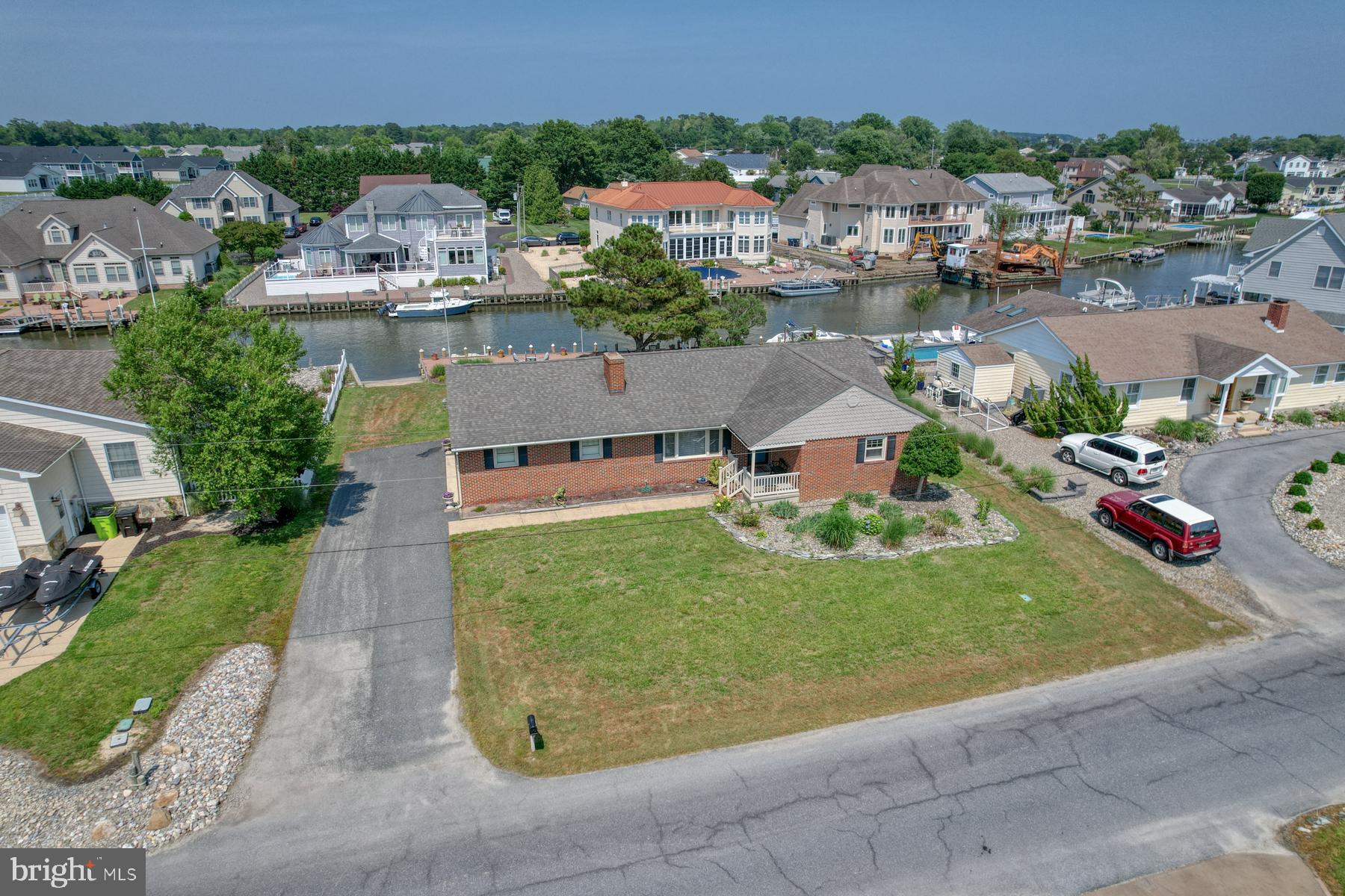 28 Marshall Road Rehoboth Beach, DE 19971 - Photo 3 of 60 an aerial view of a house with a garden and lake view