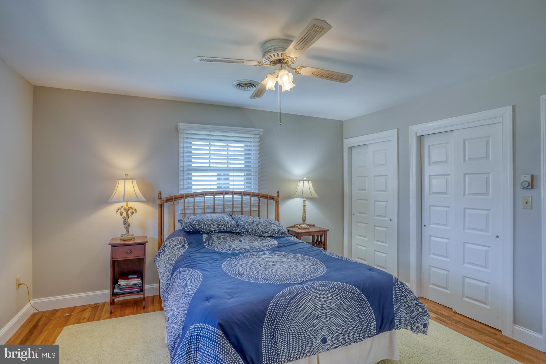 28 Marshall Road Rehoboth Beach, DE 19971 - Photo 31 of 60 a bedroom with a bed and a chandelier
