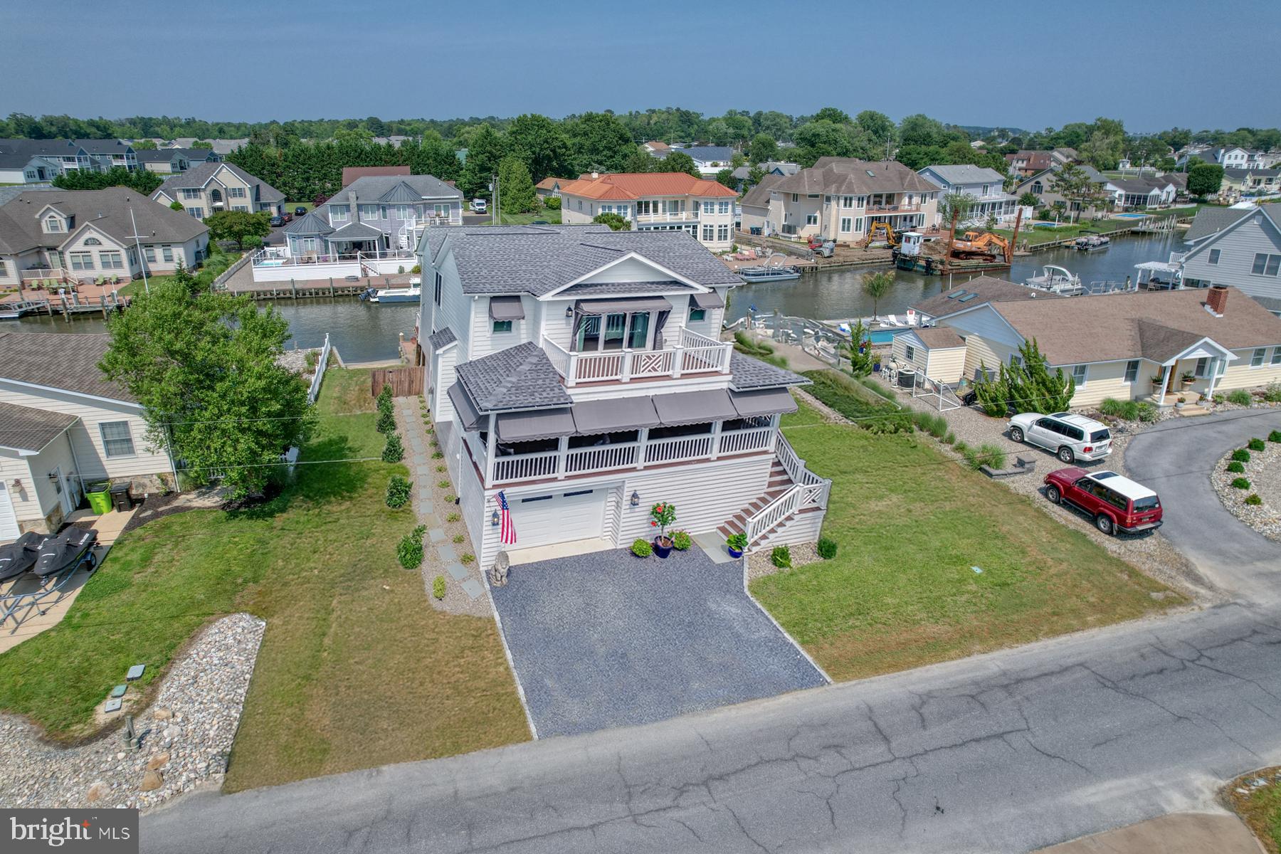 28 Marshall Road Rehoboth Beach, DE 19971 - Photo 35 of 60 an aerial view of a house with a garden and lake view