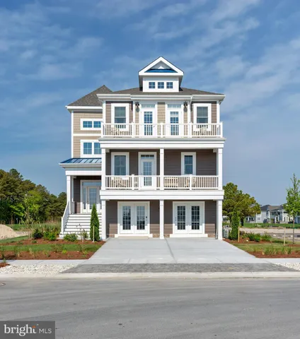 a kitchen with stainless steel appliances granite countertop a refrigerator a sink dishwasher a stove and a refrigerator with wooden floor