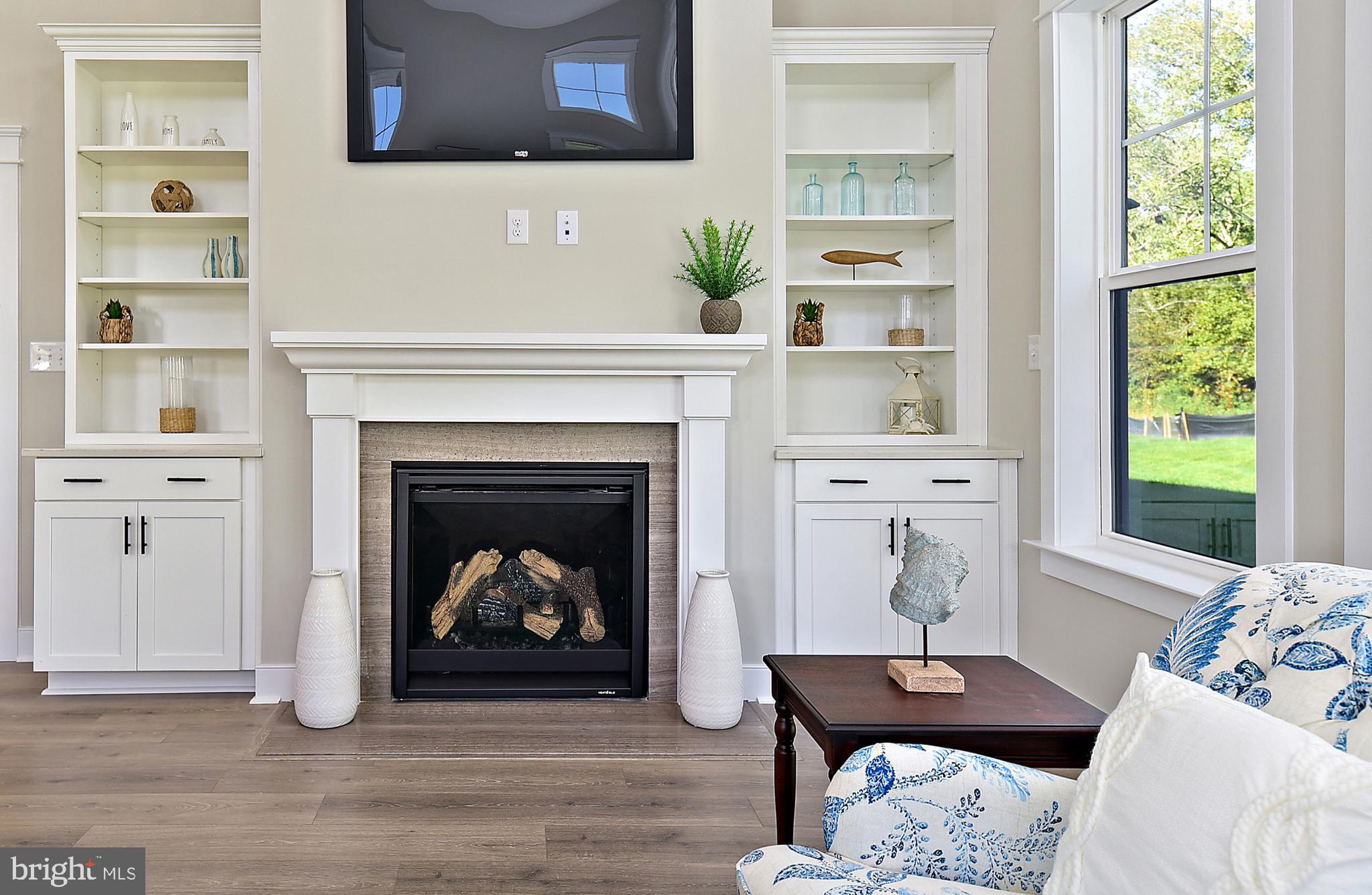 28 Marshall Road Rehoboth Beach, DE 19971 - Photo 48 of 60 a living room with furniture and a fireplace