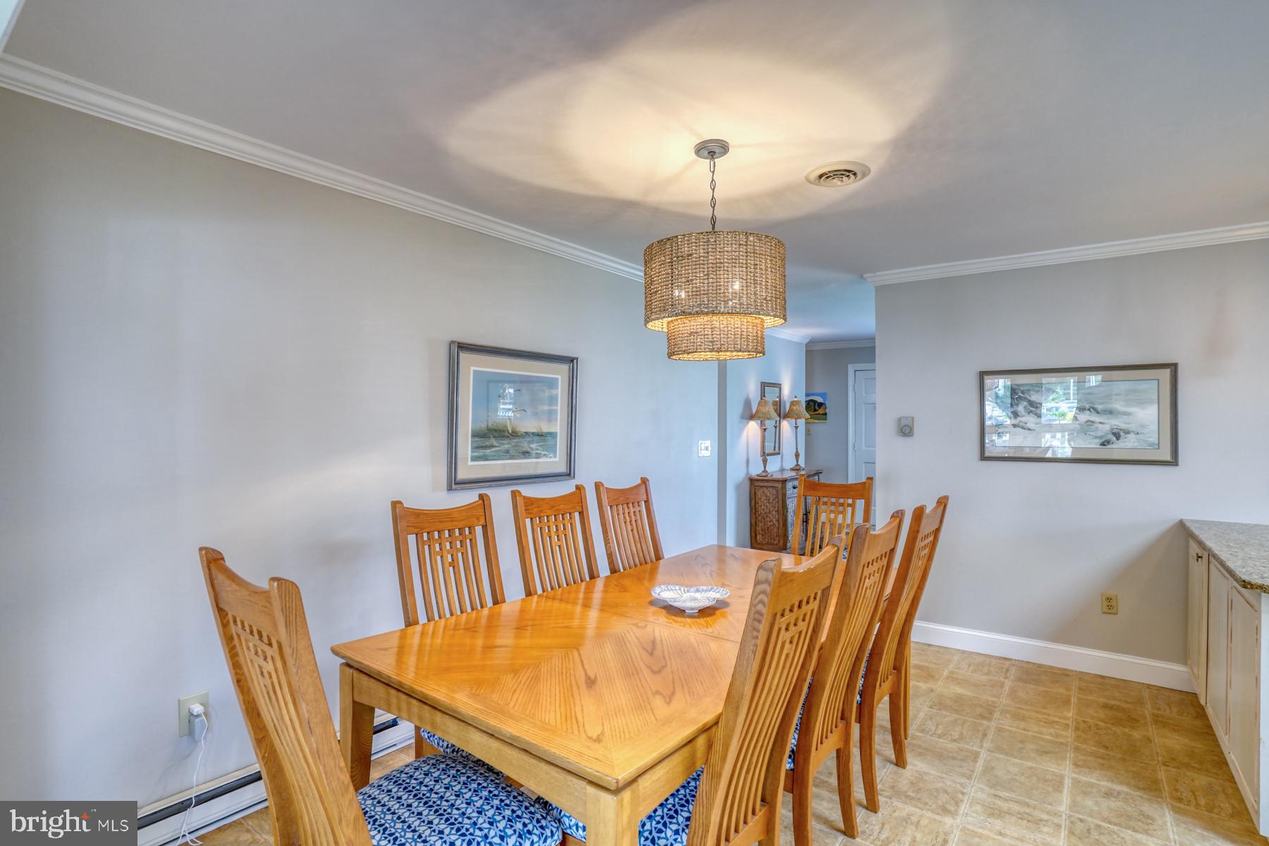 28 Marshall Road Rehoboth Beach, DE 19971 - Photo 10 of 60 a view of a dining room with furniture and chandelier
