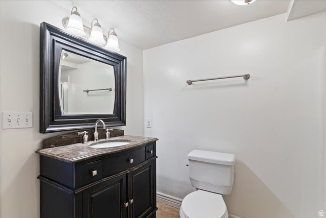 2350 South Highway 89, Unit 4 Perry, UT 84302 - Photo 18 of 30 Bathroom featuring vanity and light tile patterned floors