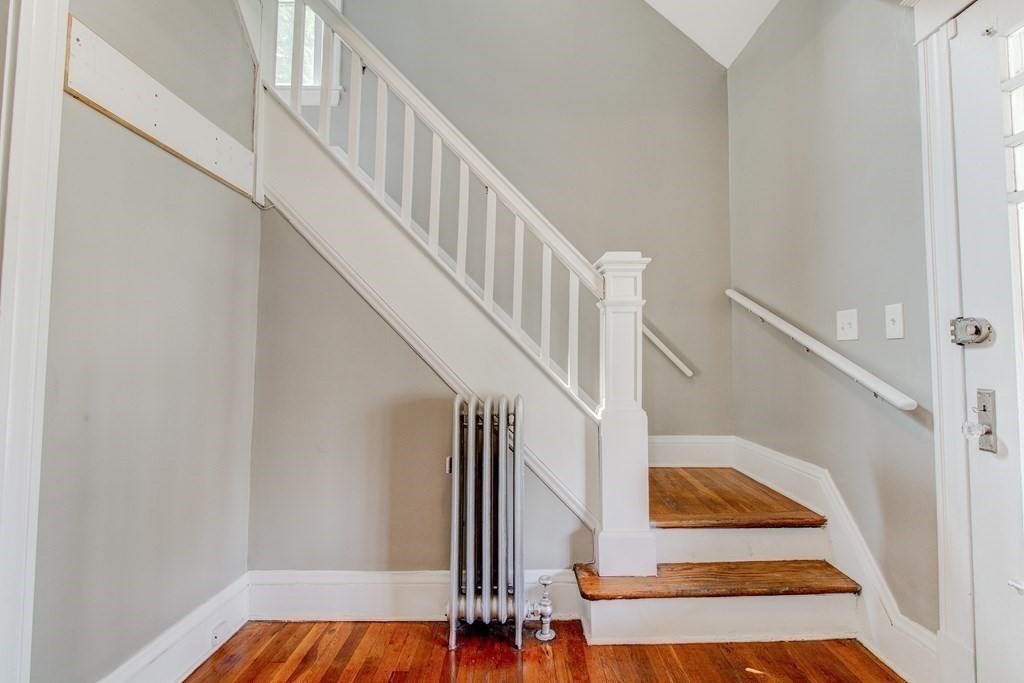 17 Belvidere Street Springfield, MA 01108 - Photo 8 of 30 a view of entryway and hall with wooden floor
