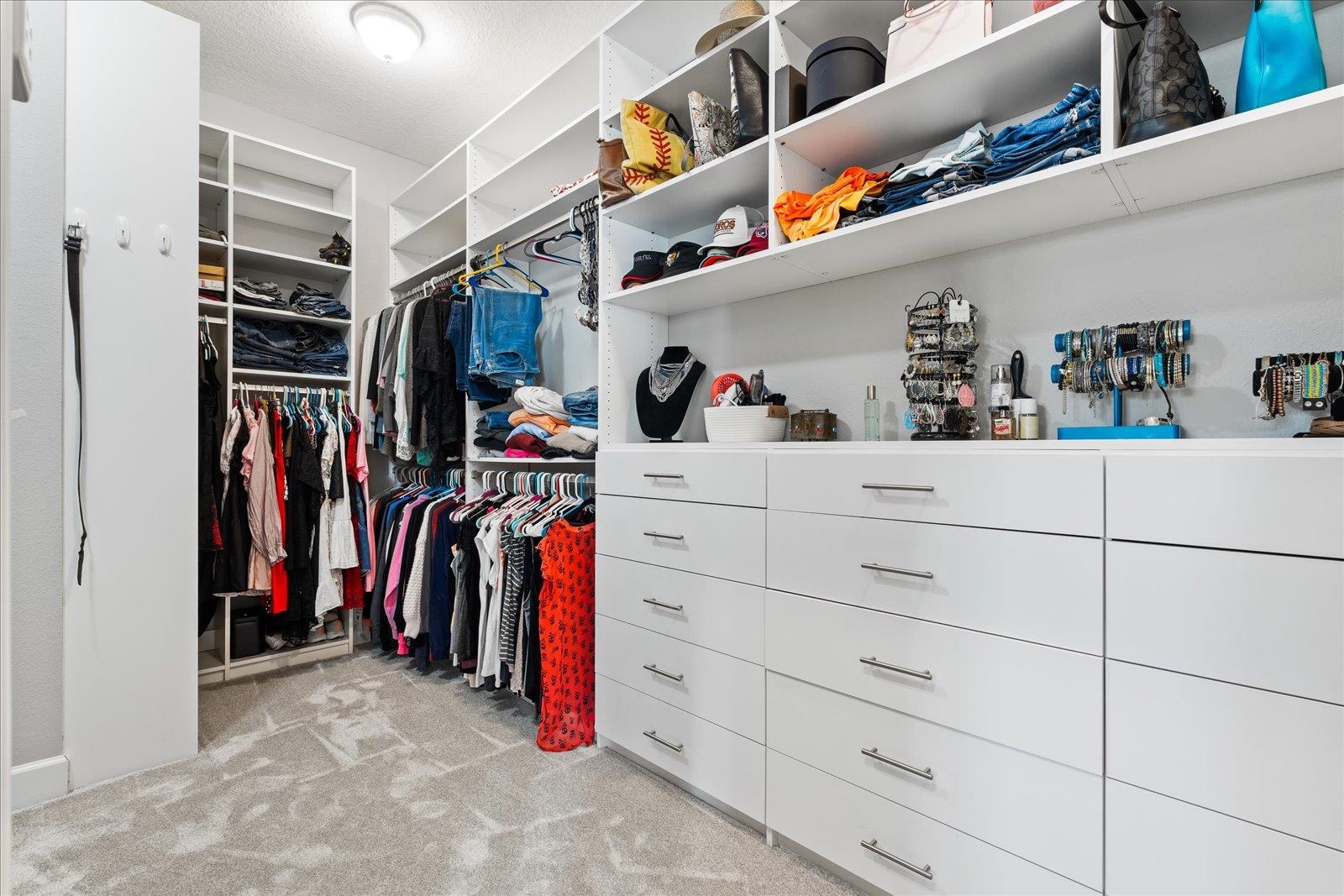 122 Kendall Way Street St. Augustine, FL 32092 - Photo 14 of 40 a view of walk in closet with clothes and shoes