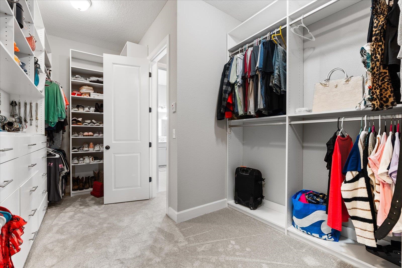 122 Kendall Way Street St. Augustine, FL 32092 - Photo 15 of 40 a view of walk in closet with clothes and shoes