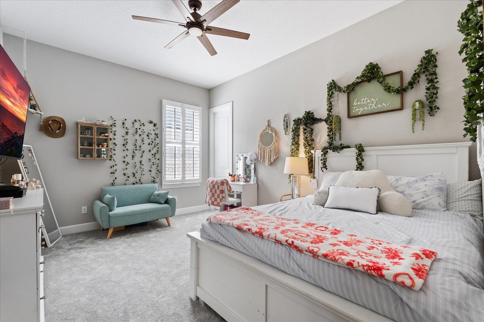 122 Kendall Way Street St. Augustine, FL 32092 - Photo 16 of 40 a bedroom with a bed couch and a window