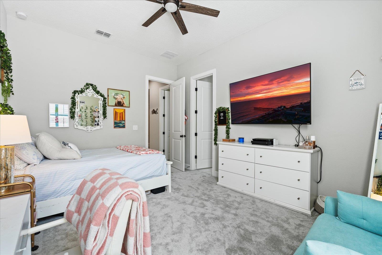 122 Kendall Way Street St. Augustine, FL 32092 - Photo 17 of 40 a bedroom with a bed and a flat screen tv in it