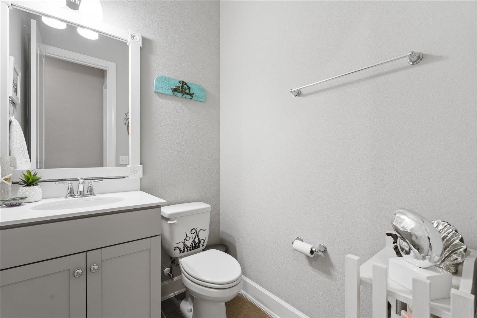 122 Kendall Way Street St. Augustine, FL 32092 - Photo 19 of 40 a bathroom with a granite countertop sink mirror vanity and toilet