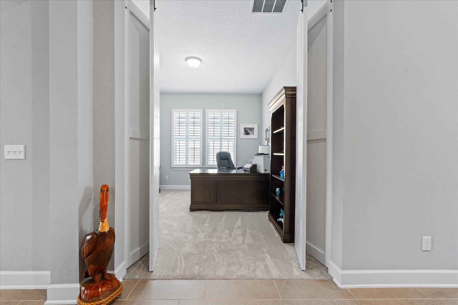 122 Kendall Way Street St. Augustine, FL 32092 - Photo 23 of 40 a living room with furniture and a flat screen tv