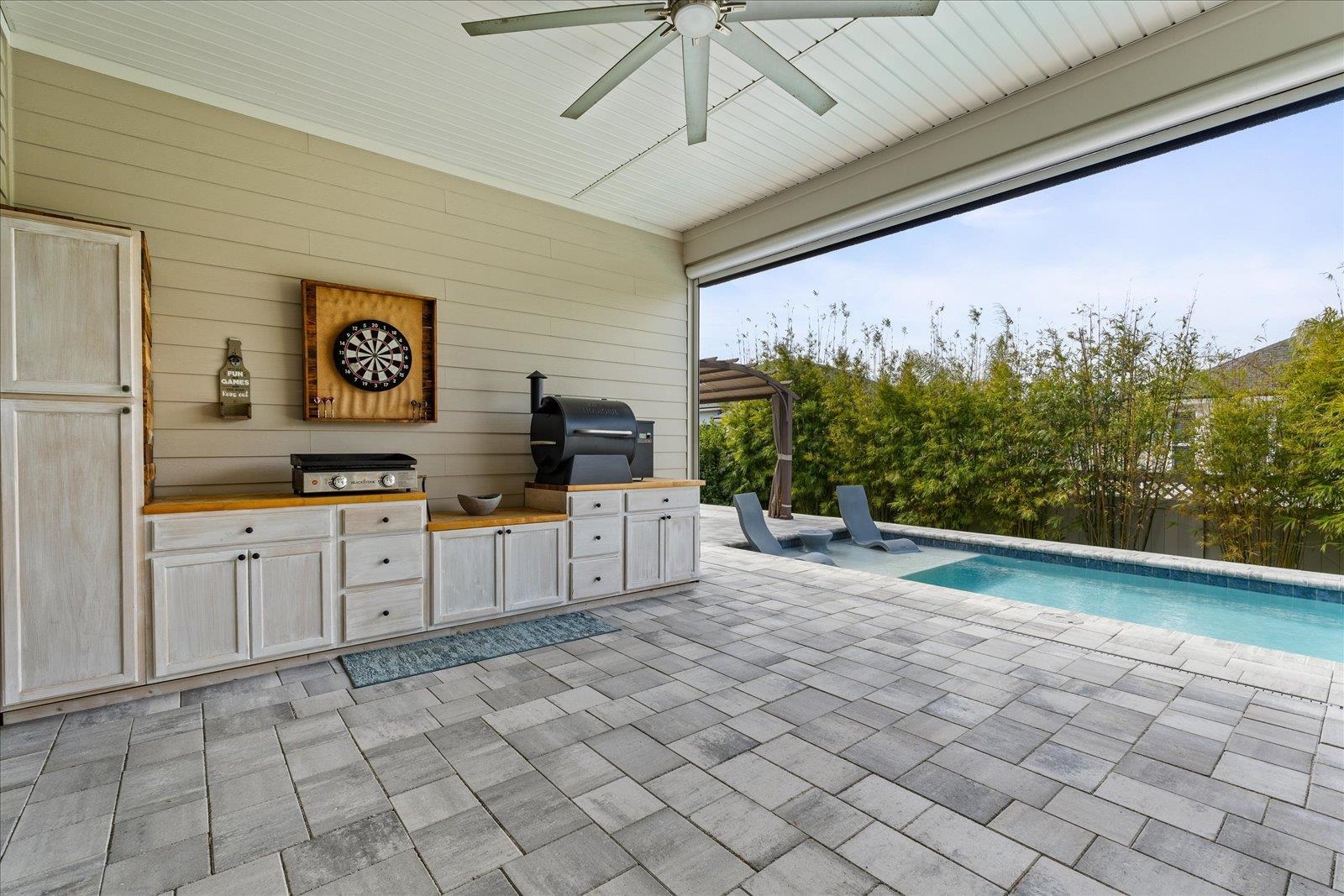 122 Kendall Way Street St. Augustine, FL 32092 - Photo 28 of 40 a large white kitchen with cabinets a washer and dryer
