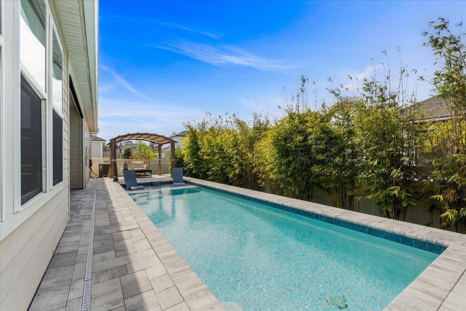 122 Kendall Way Street St. Augustine, FL 32092 - Photo 33 of 40 a view of a swimming pool with a yard