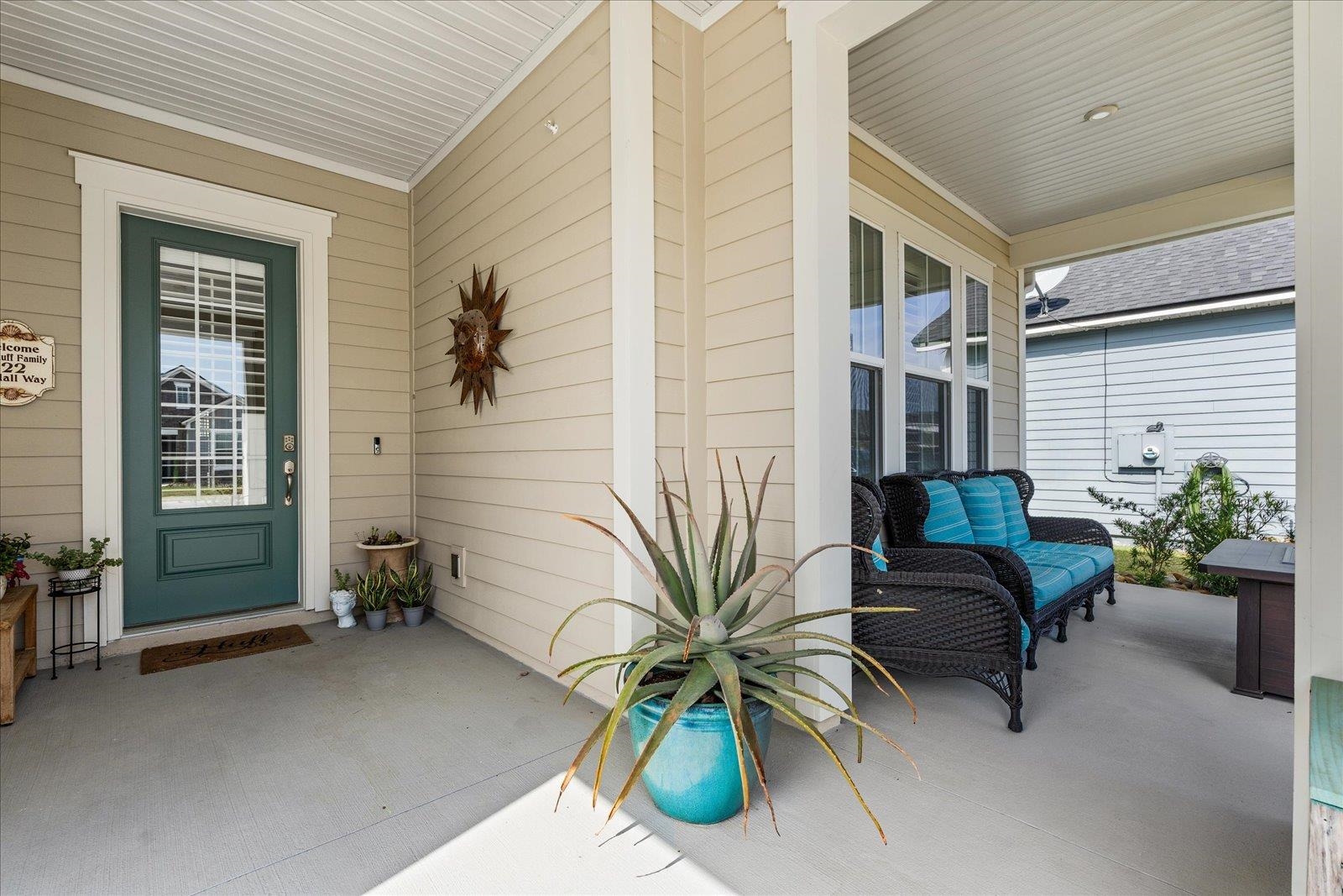 122 Kendall Way Street St. Augustine, FL 32092 - Photo 4 of 40 a potted plant sitting in front of a house