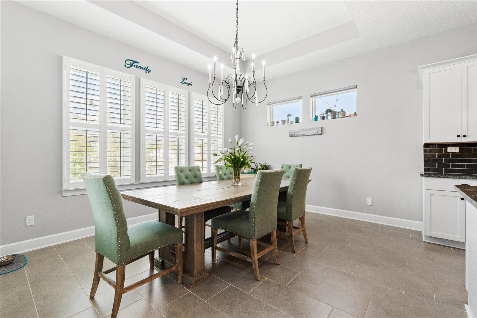122 Kendall Way Street St. Augustine, FL 32092 - Photo 9 of 40 a view of a dining room with furniture window and wooden floor