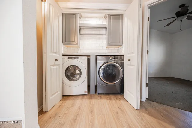 a view of washer and dryer in a utility room