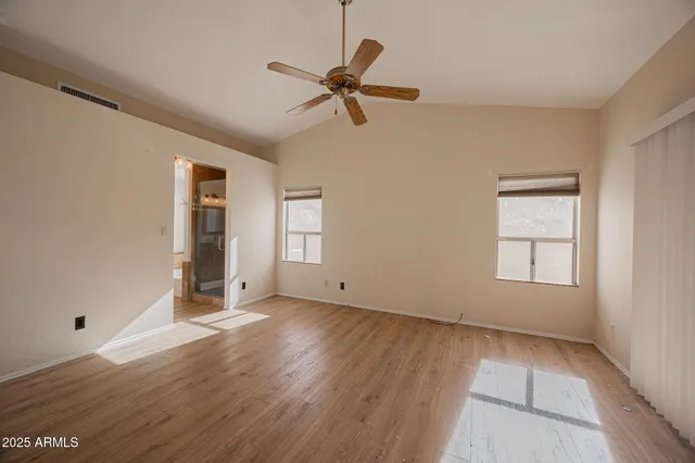 a view of an empty room with a window