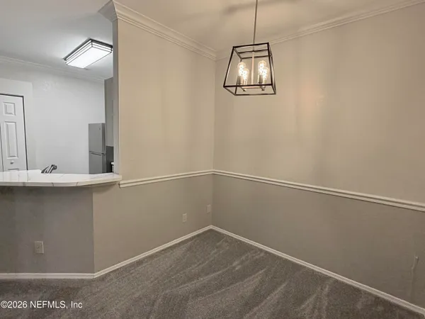 a view of a room with window and wooden floor