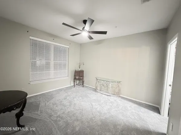 a view of an empty room with a window