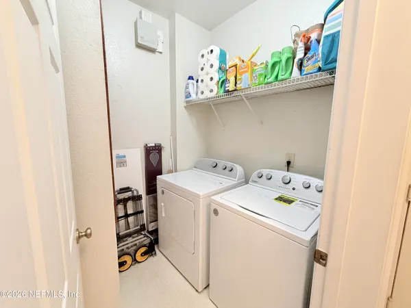 a utility room with dryer and washer