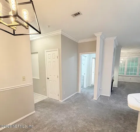 a view of a room with wooden floor and windows