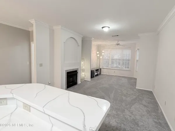 a large white bed in a white room