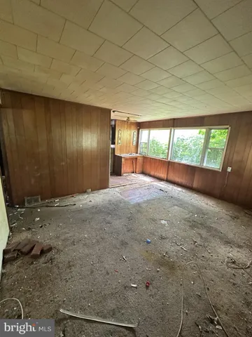 a kitchen with refrigerator and cabinets