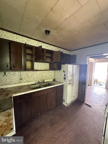 a kitchen with a stove and a refrigerator