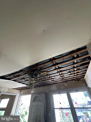 a view of a livingroom with furniture and a window