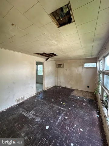 a view of empty room with windows