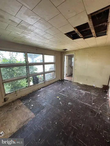 a view of an empty room with a sliding door