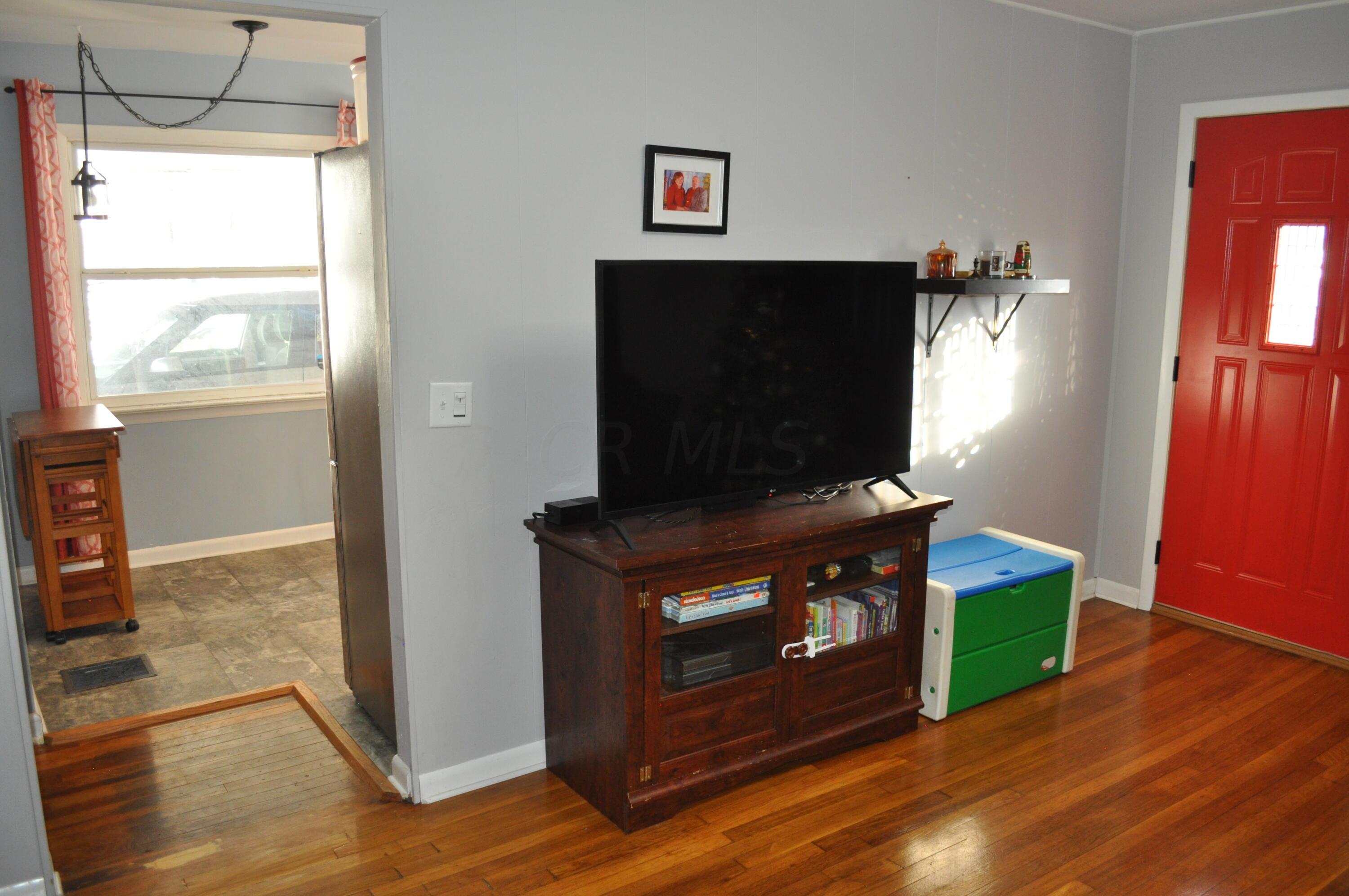 3386 Eakin Road Columbus, OH 43204 - Photo 11 of 31 Living Room Into Kitchen