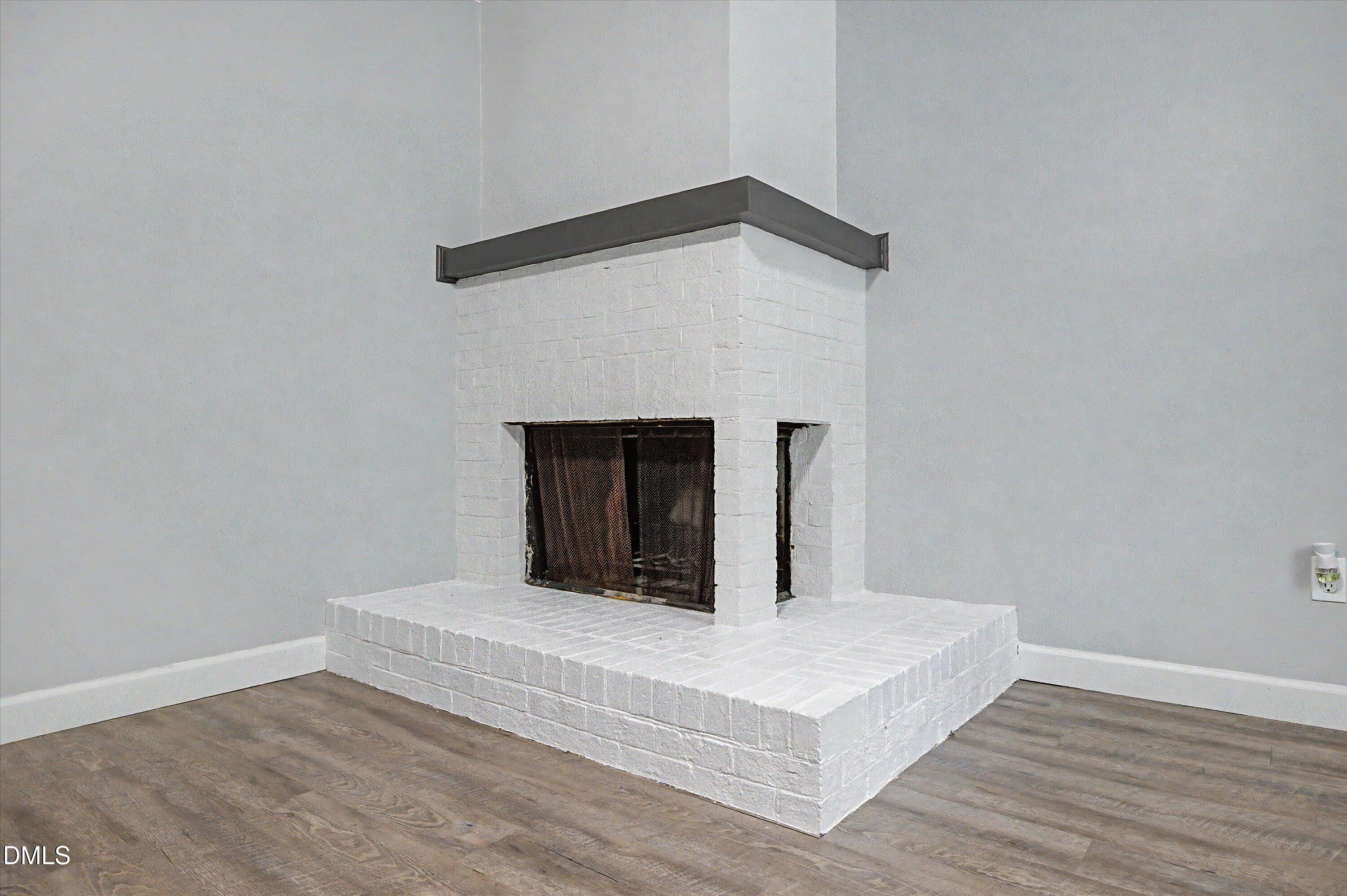 5519 Hamstead Crossing Raleigh, NC 27612 - Photo 7 of 33 a bedroom with a bed and a fireplace