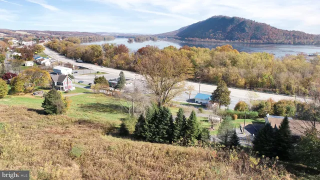 a view of a town with mountains in the background
