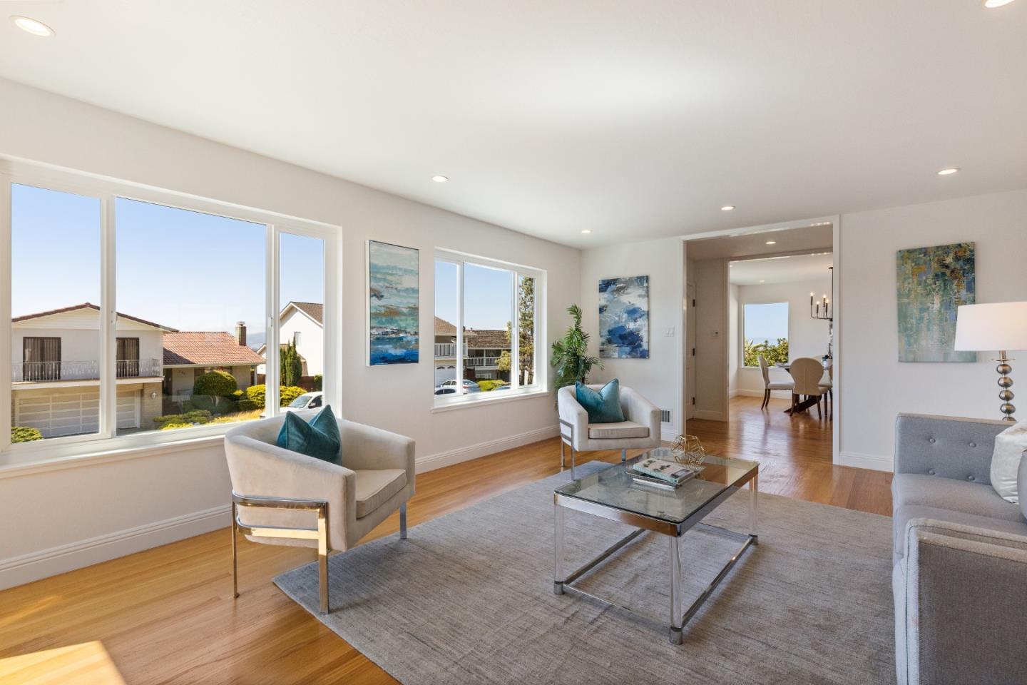 735 Clearfield Drive Millbrae, CA 94030 - Photo 11 of 64 a living room with furniture and a table with wooden floor