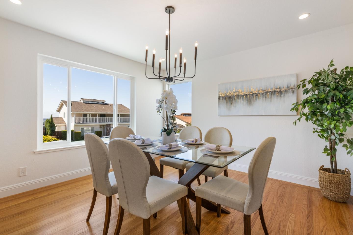 735 Clearfield Drive Millbrae, CA 94030 - Photo 13 of 64 a dining room with furniture a chandelier and wooden floor