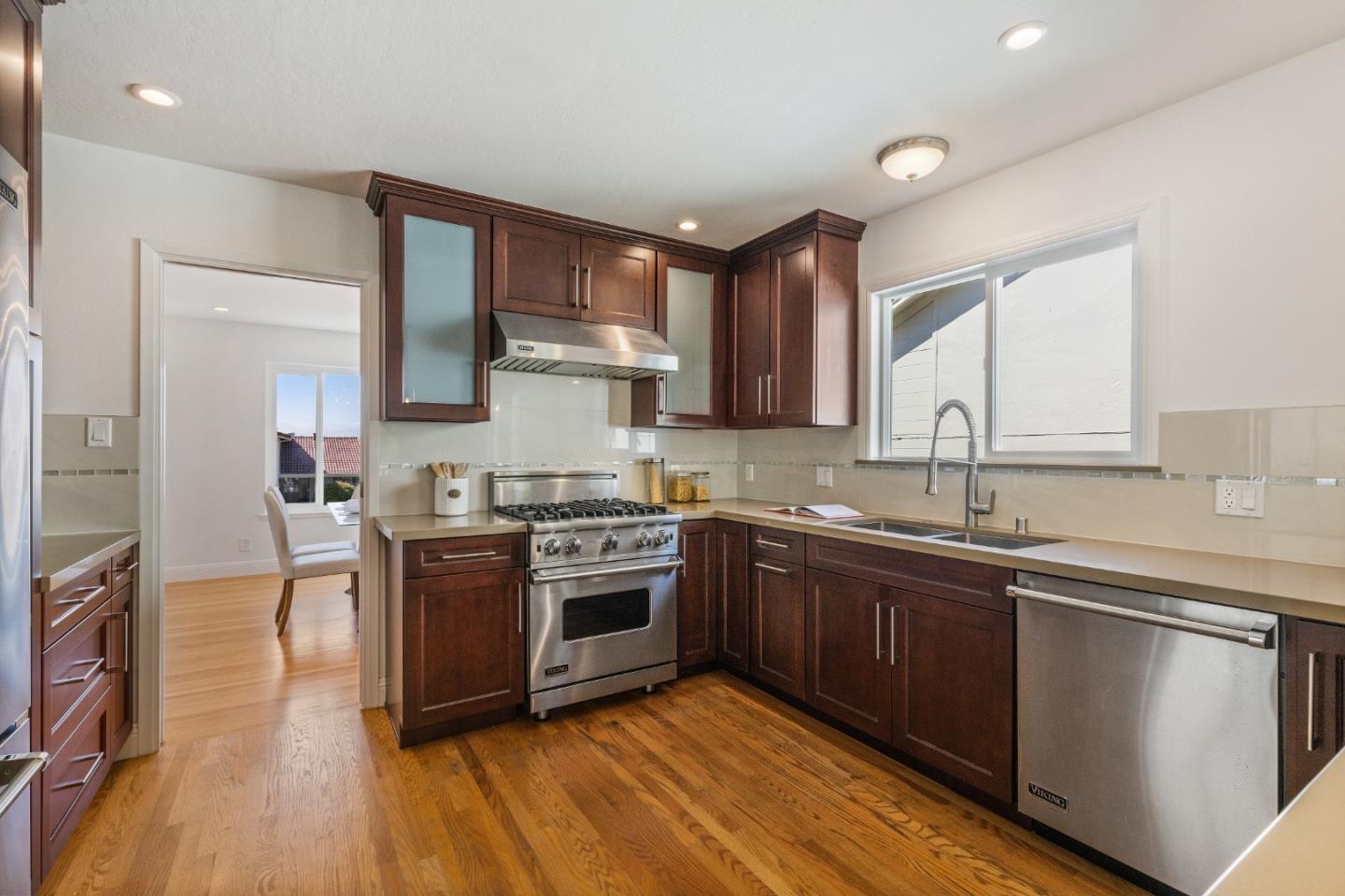 735 Clearfield Drive Millbrae, CA 94030 - Photo 16 of 64 a kitchen with stainless steel appliances granite countertop a stove a sink dishwasher and a refrigerator