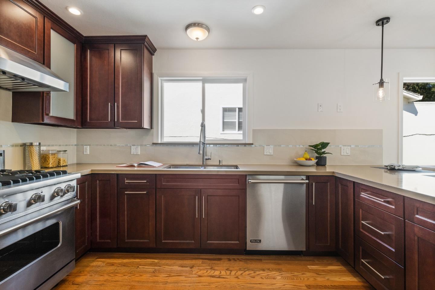 735 Clearfield Drive Millbrae, CA 94030 - Photo 18 of 64 a kitchen with stainless steel appliances granite countertop a sink stove and refrigerator