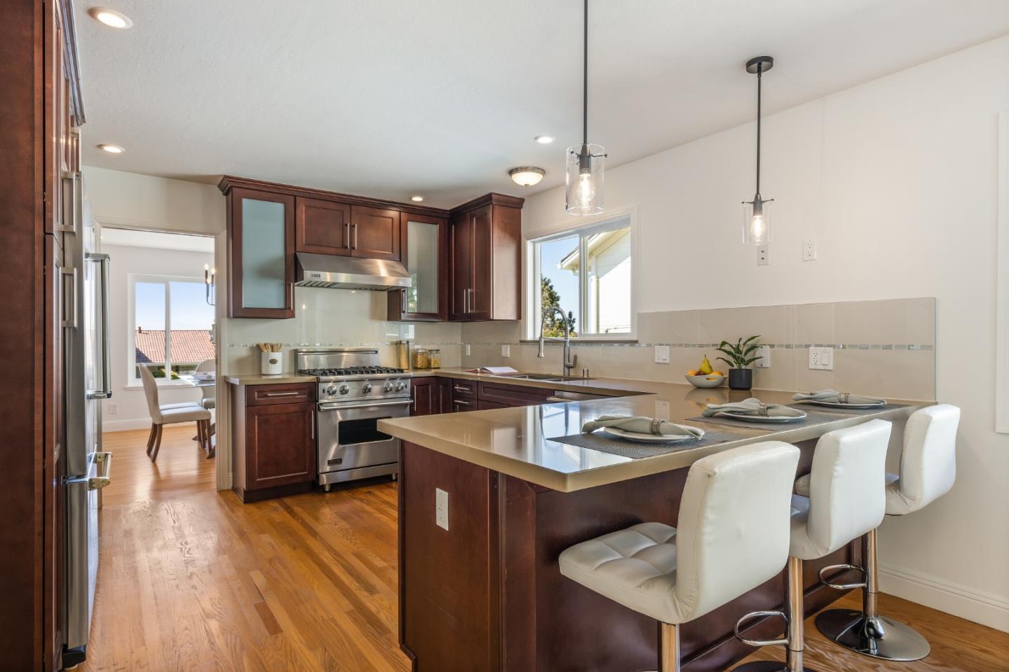 735 Clearfield Drive Millbrae, CA 94030 - Photo 19 of 64 a kitchen with a sink stove a refrigerator and a microwave