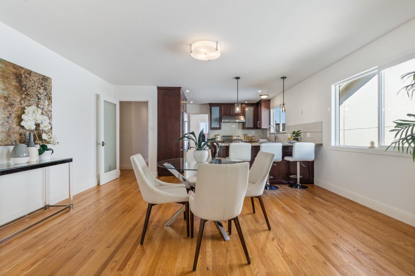 735 Clearfield Drive Millbrae, CA 94030 - Photo 21 of 64 a view of a dining room with furniture and wooden floor