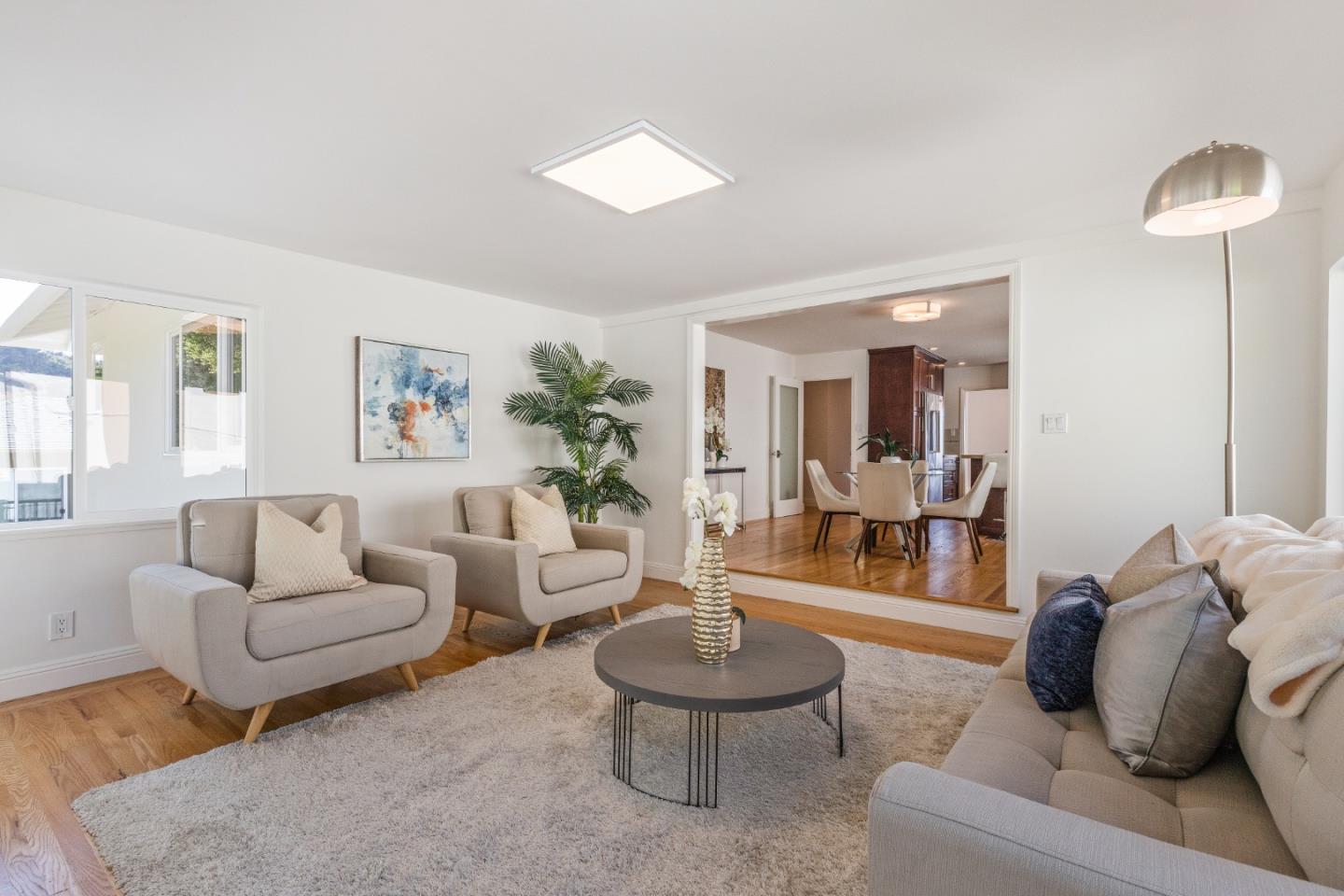 735 Clearfield Drive Millbrae, CA 94030 - Photo 26 of 64 a living room with furniture and a wooden floor